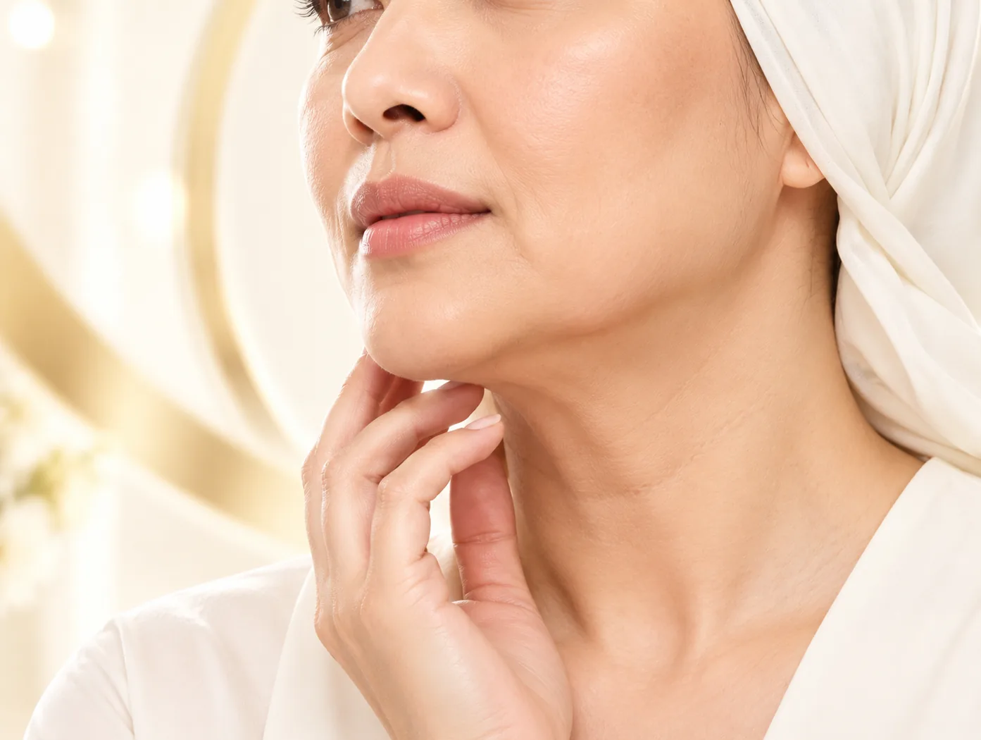 Woman touching her jawline and neck